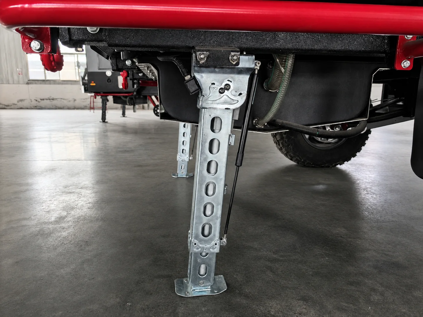 AOZI 12V Four-Leg Sensor-Based Automatic Leveling & Stabilization System — Installed leg and chassis relationship